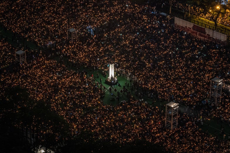 A view from above as people hold candles at night as they take part in the vigil at Victoria Park.