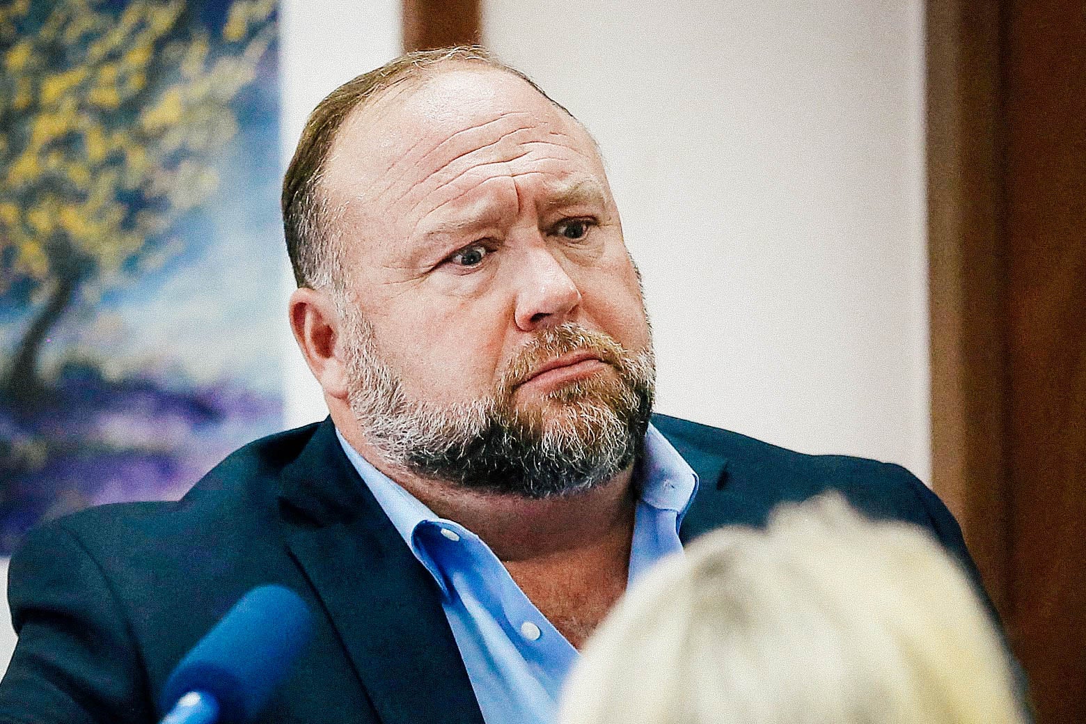 Alex Jones attempts to answer questions about his emails asked by Mark Bankston, lawyer for Neil Heslin and Scarlett Lewis, during trial at the Travis County Courthouse, Austin, Texas, U.S., August 3, 2022.

