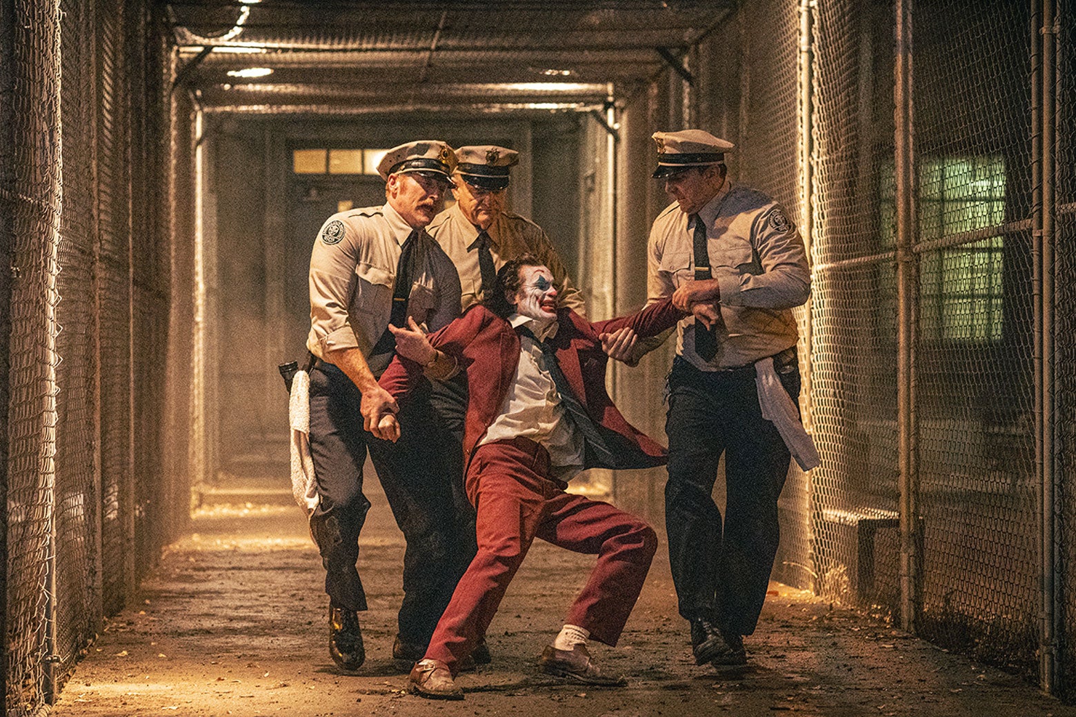 joker being taken by the guards