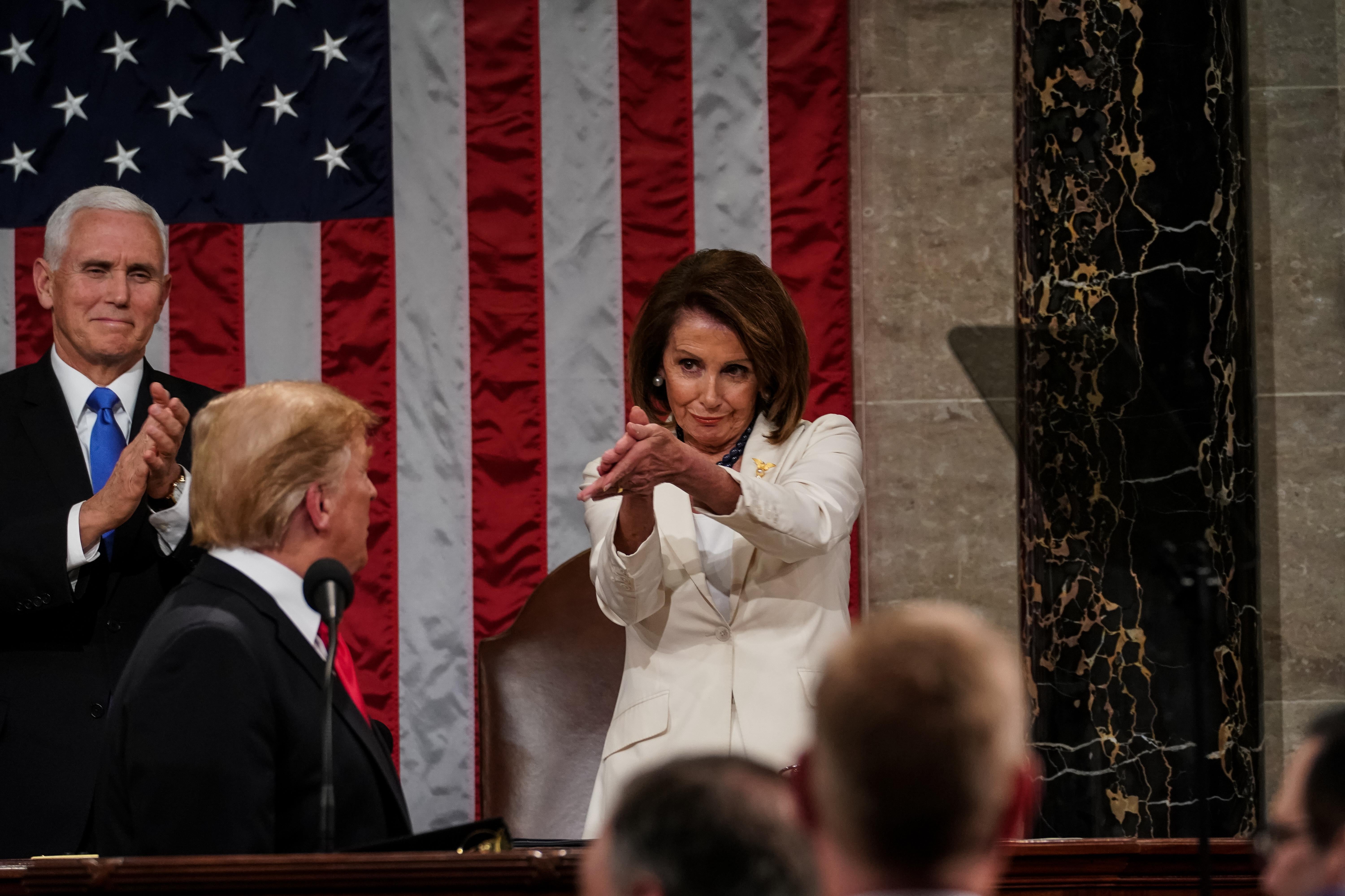 Speaker Nancy Pelosi claps at President Trump during the State of the Union.