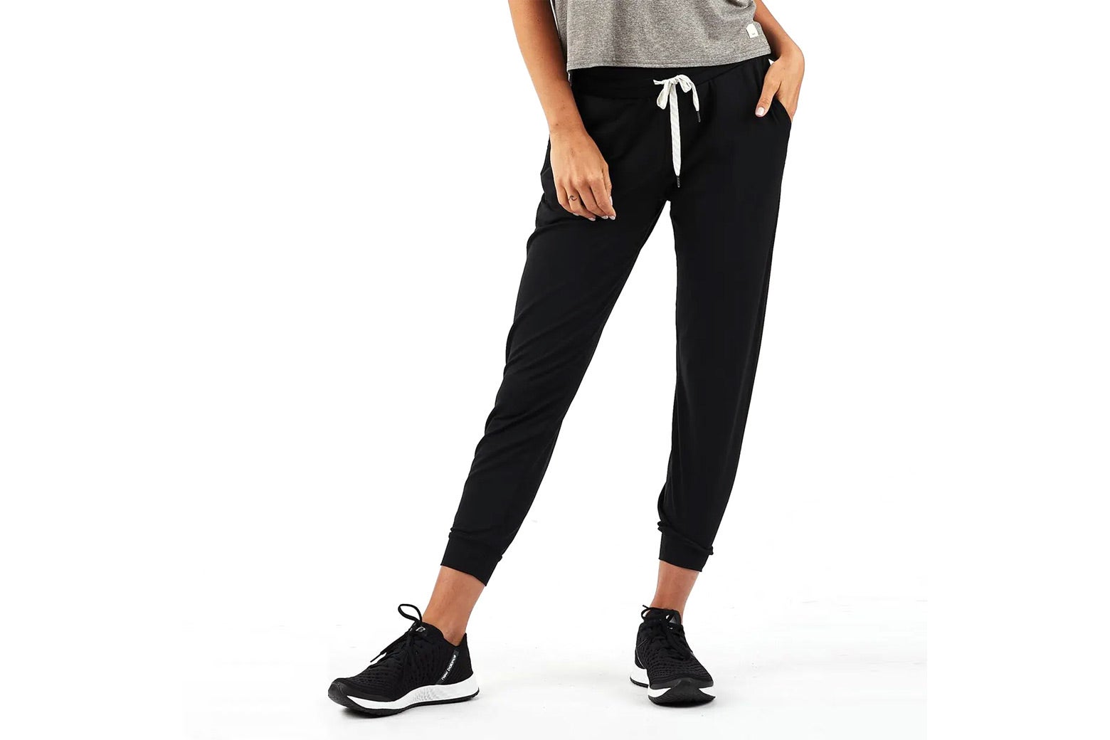 Lower body of model wearing black joggers
