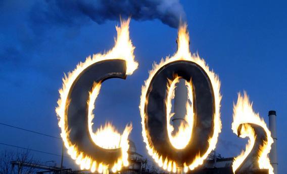 Greenpeace activists burn a symbol of carbon dioxide as they demonstrate in 2008 in front of the Klingenberg power plant in Berlin.
