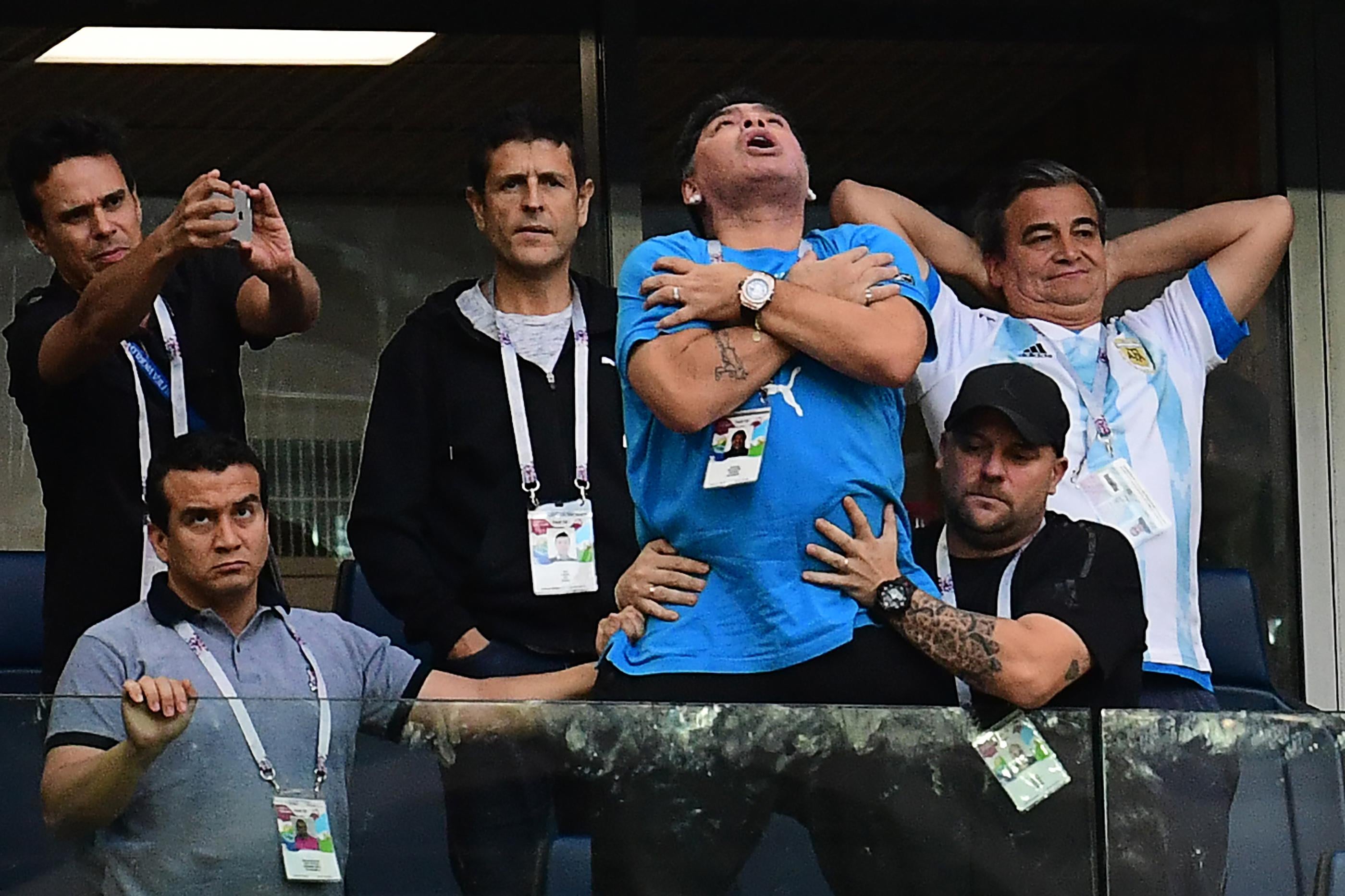 Former Argentina forward Diego Maradona (C) celebrates the opening goal during the Russia 2018 World Cup Group D football match between Nigeria and Argentina at the Saint Petersburg Stadium in Saint Petersburg on June 26, 2018. (Photo by Giuseppe CACACE / AFP) / RESTRICTED TO EDITORIAL USE - NO MOBILE PUSH ALERTS/DOWNLOADS (Photo credit should read GIUSEPPE CACACE/AFP/Getty Images)