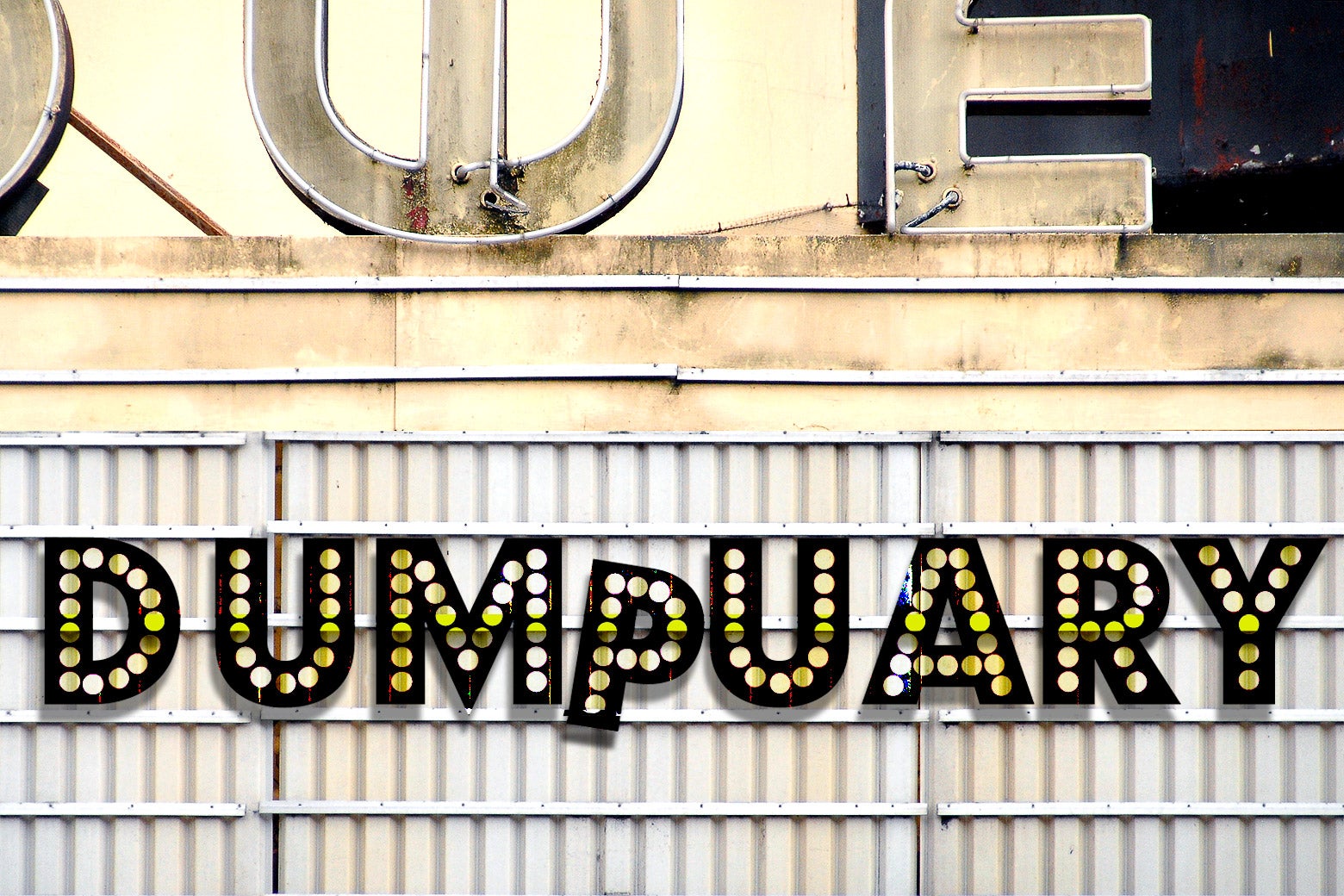 A decrepit movie marquee with the word "DUMPUARY" plastered on it.