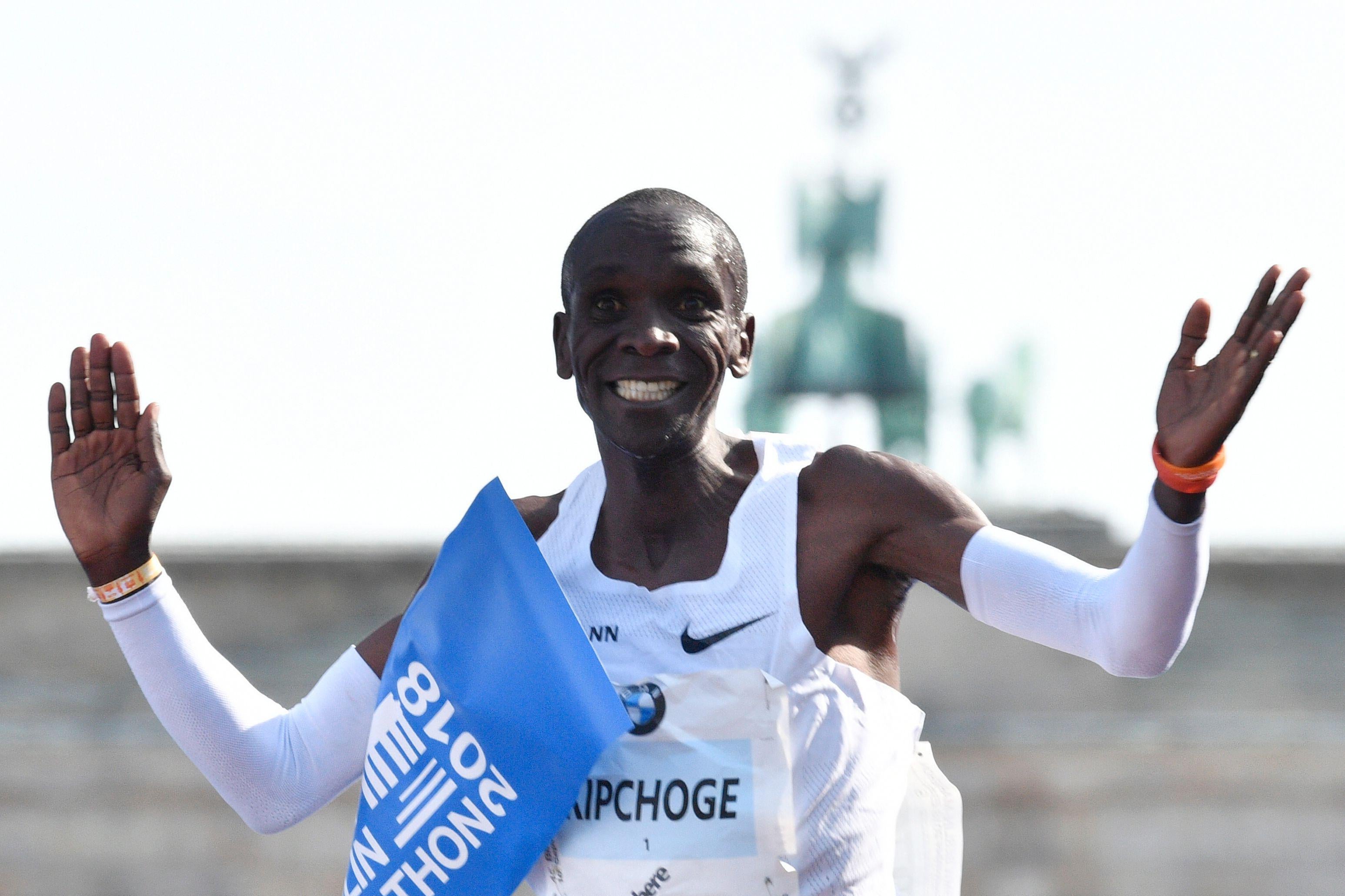 Kenya's Eliud Kipchoge crosses the finish line to win the Berlin Marathon setting a new world record with 2h01:39 on September 16, 2018 in Berlin. (Photo by John MACDOUGALL / AFP)        (Photo credit should read JOHN MACDOUGALL/AFP/Getty Images)