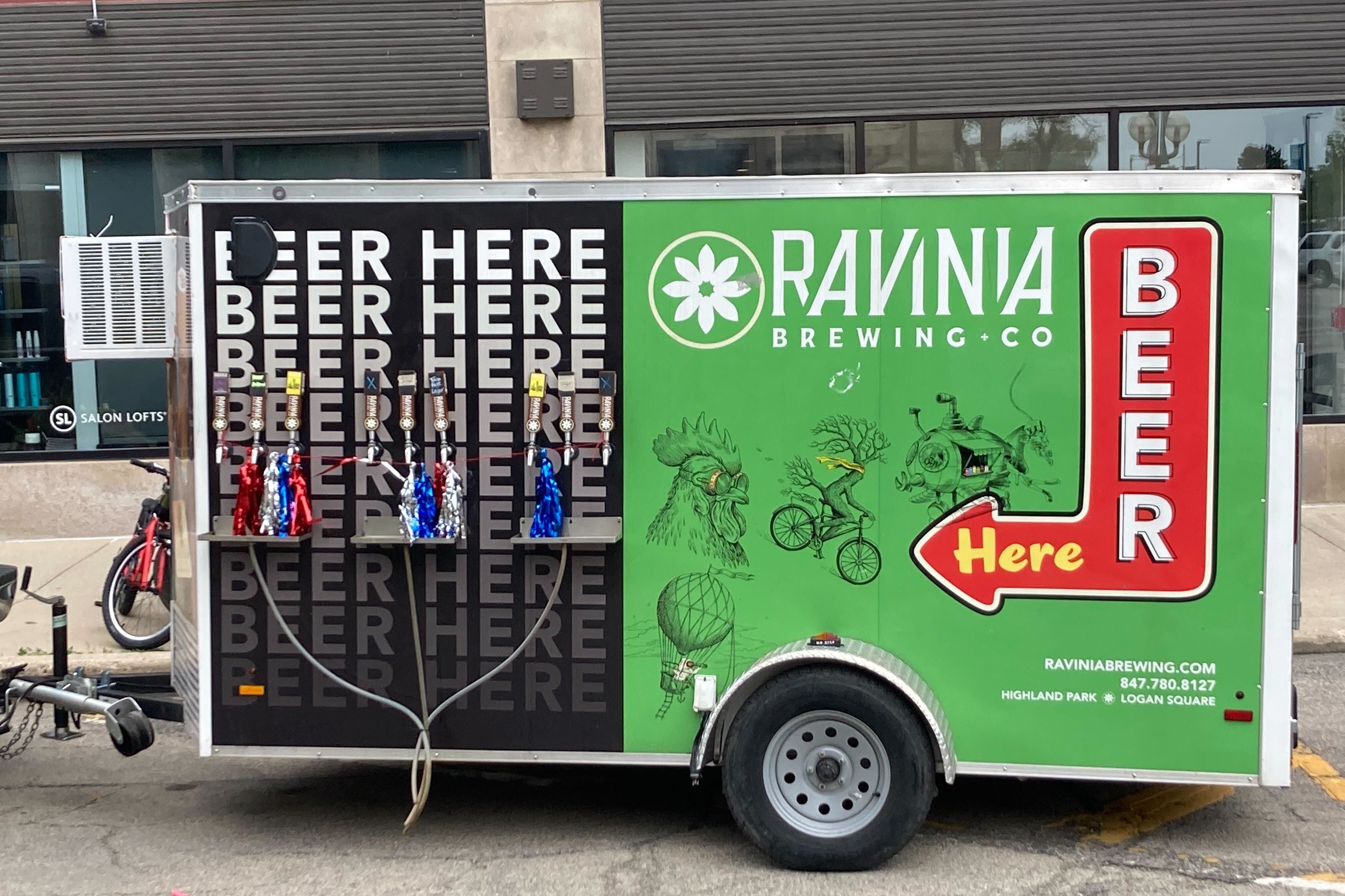 A green and black Ravinia Brewing Co. beer truck