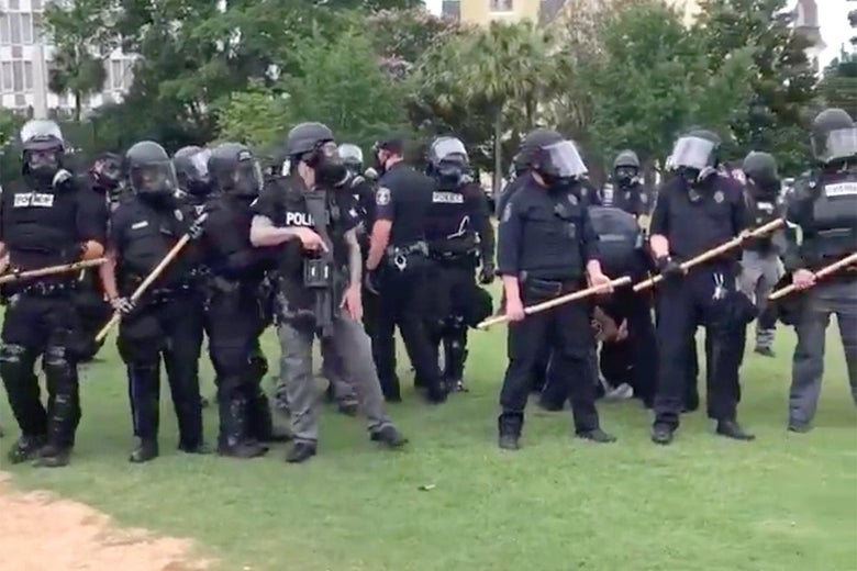 Protesters arrested for speaking to, near police officers.