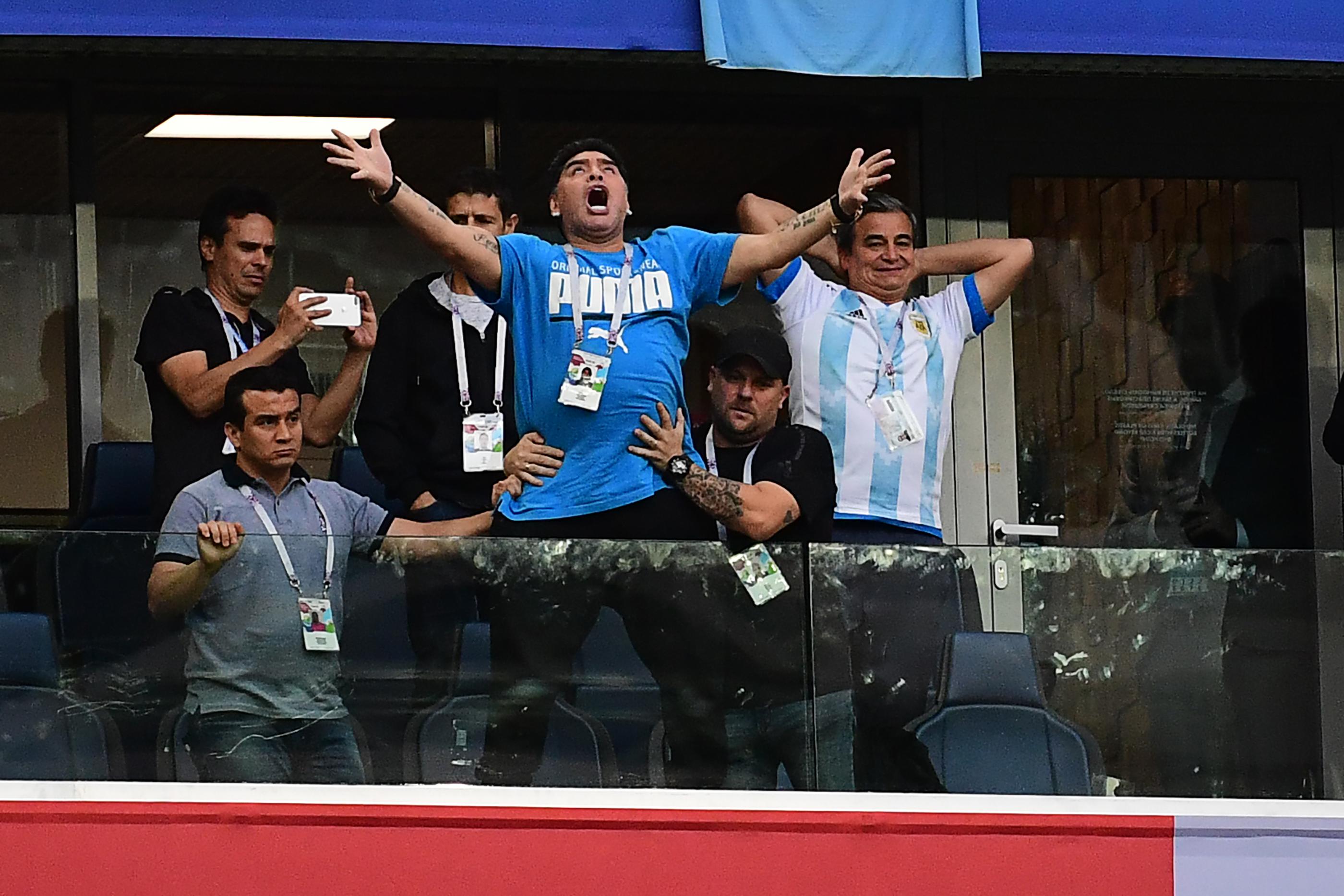 Former Argentina forward Diego Maradona (C) celebrates the opening goal during the Russia 2018 World Cup Group D football match between Nigeria and Argentina at the Saint Petersburg Stadium in Saint Petersburg on June 26, 2018. (Photo by Giuseppe CACACE / AFP) / RESTRICTED TO EDITORIAL USE - NO MOBILE PUSH ALERTS/DOWNLOADS        (Photo credit should read GIUSEPPE CACACE/AFP/Getty Images)
