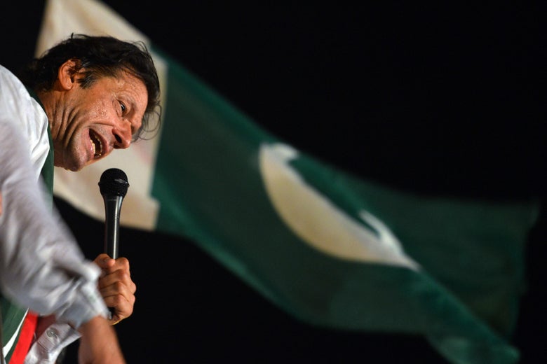 Pakistani opposition politician Imran Khan addresses his supporters during an anti-government protest in front of the Parliament building in Islamabad on August 21, 2014. Pakistani opposition politician Imran Khan on August 21, 2014 called off talks with the government aimed at ending protests seeking the fall of the prime minister, which have unnerved the nuclear-armed nation. Khan and populist cleric Tahir-ul-Qadri have led followers protesting outside parliament for the past two days demanding Prime Minister Nawaz Sharif quit.  AFP PHOTO/ AAMIR QURESHI        (Photo credit should read AAMIR QURESHI/AFP/Getty Images)