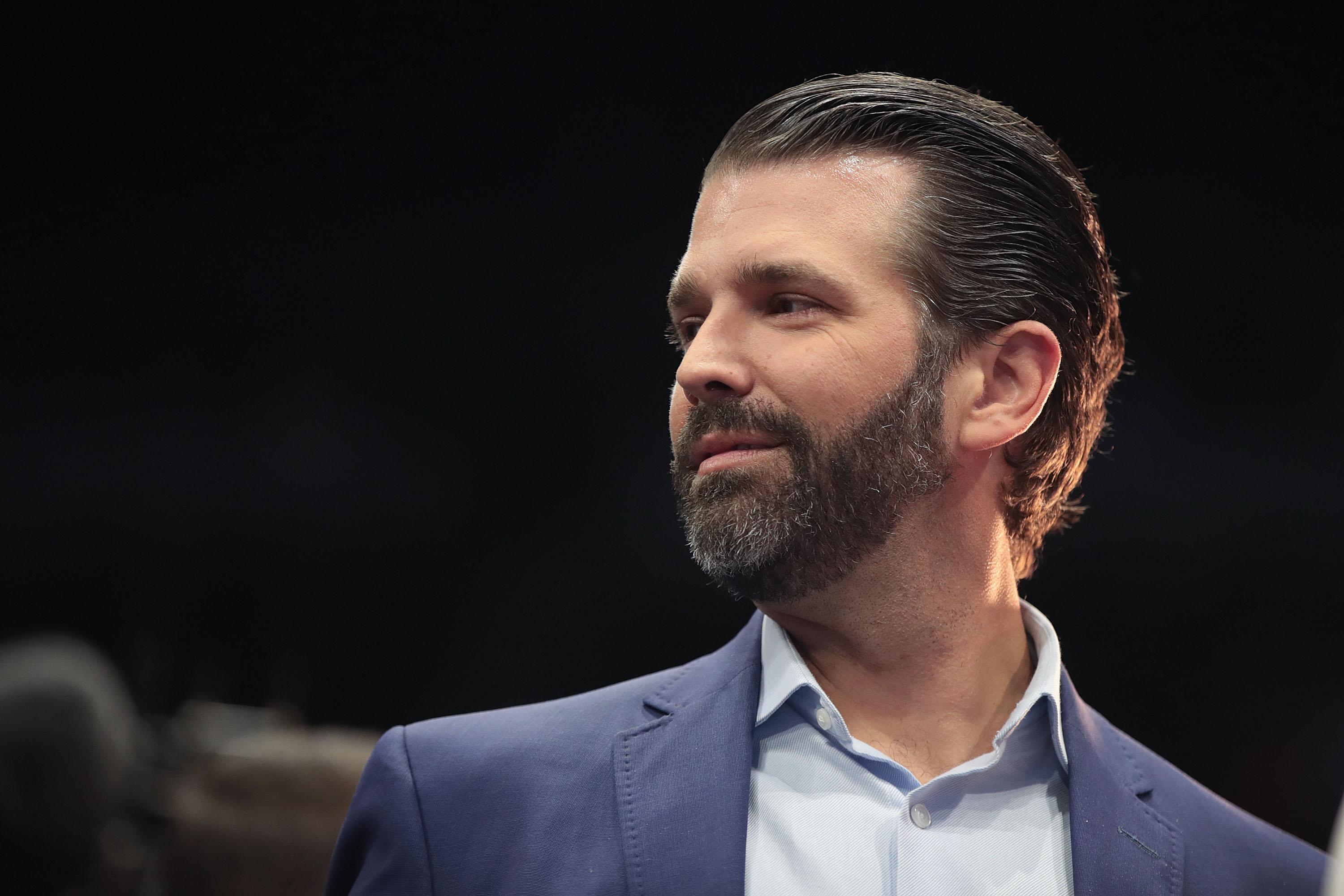 Donald Trump Jr. talks to the press before a rally at the Van Andel Arena on March 28 in Grand Rapids, Michigan.