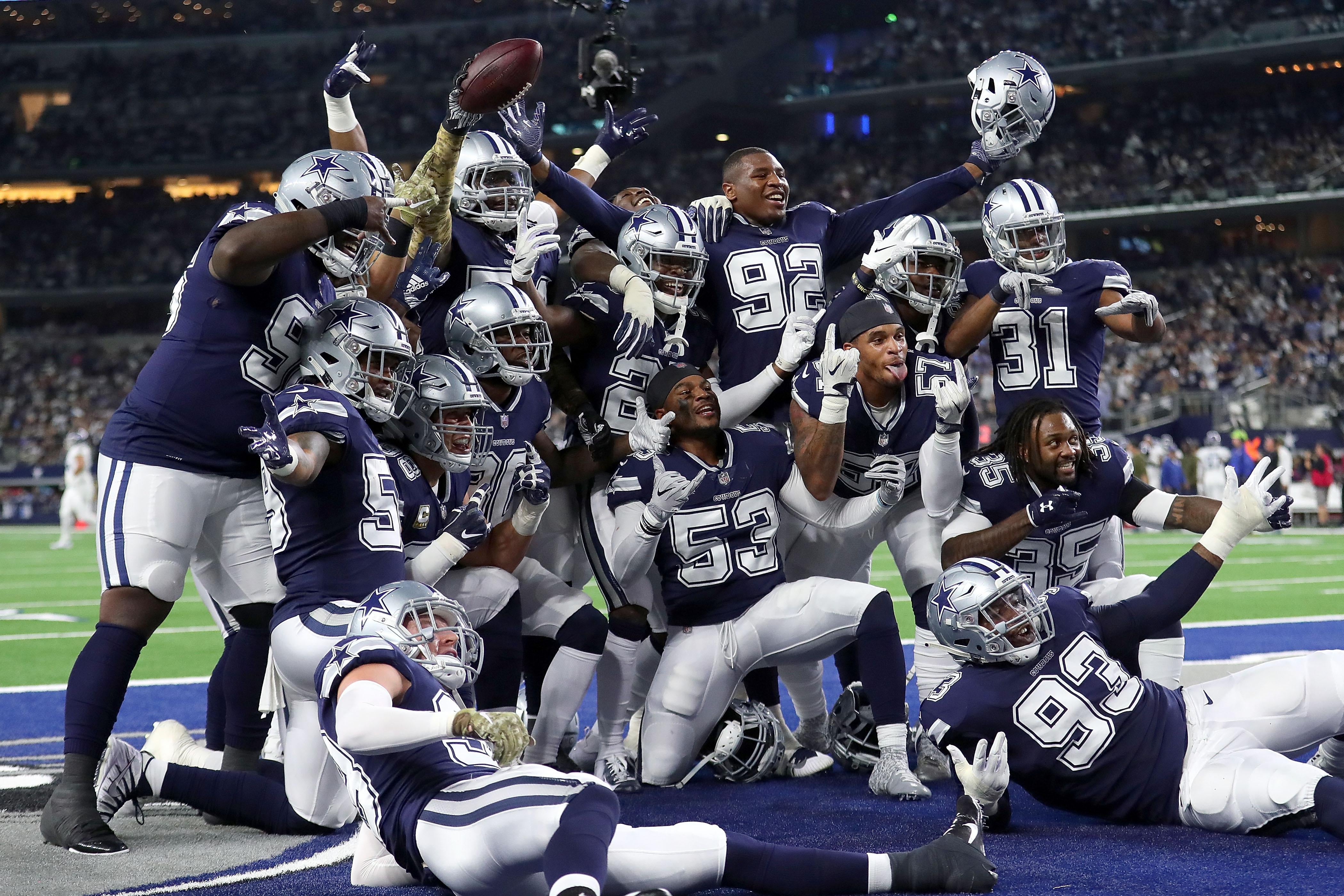 ARLINGTON, TX - NOVEMBER 05:  The Dallas Cowboys defensive line poses for a photo in the end zone after a fumble recovery against the Tennessee Titans in the first quarter of a football game at AT&T Stadium on November 5, 2018 in Arlington, Texas. (Photo by Tom Pennington/Getty Images)