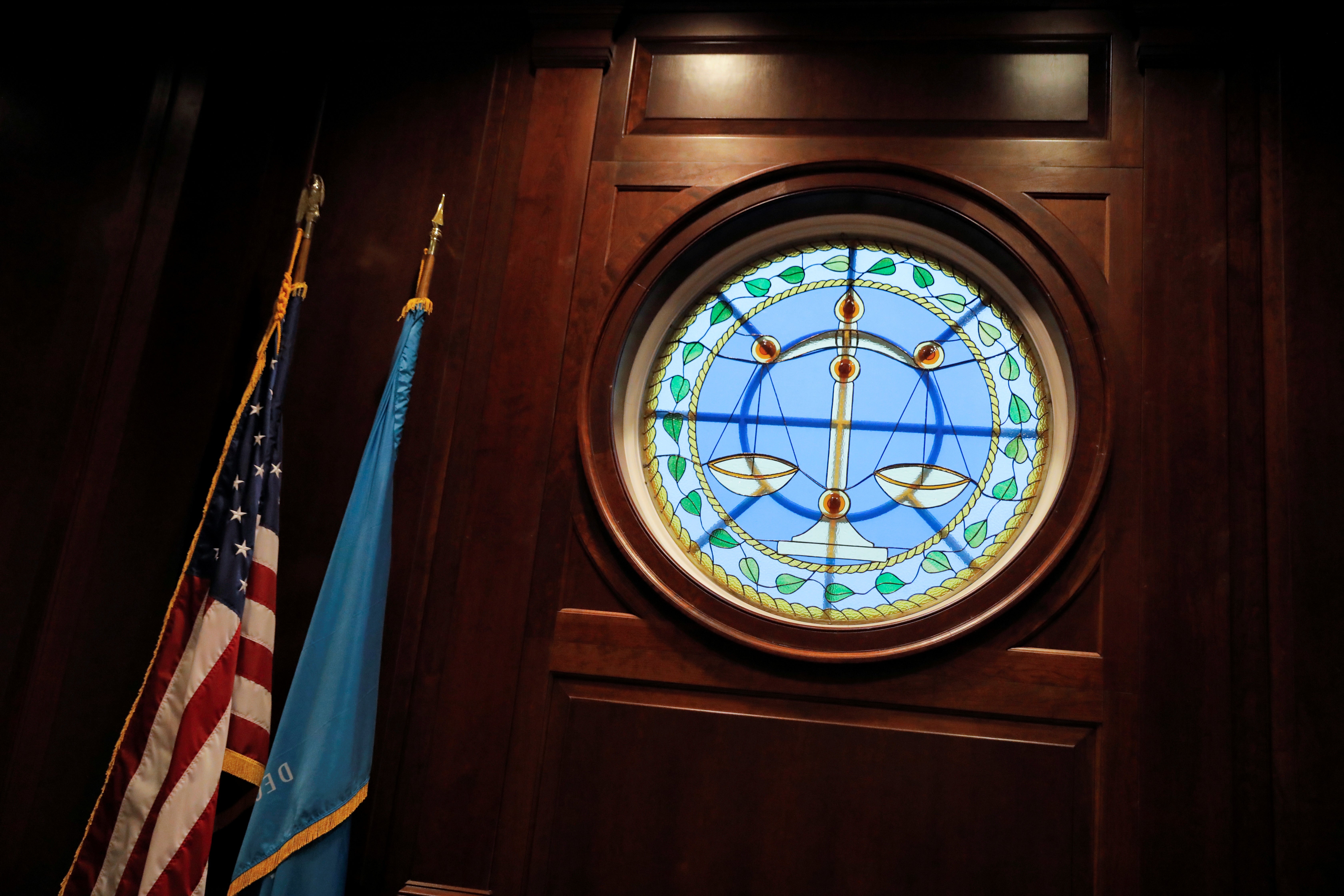 The seal of the Delaware Chancery Court, seen next to the U.S. and Delaware flags.