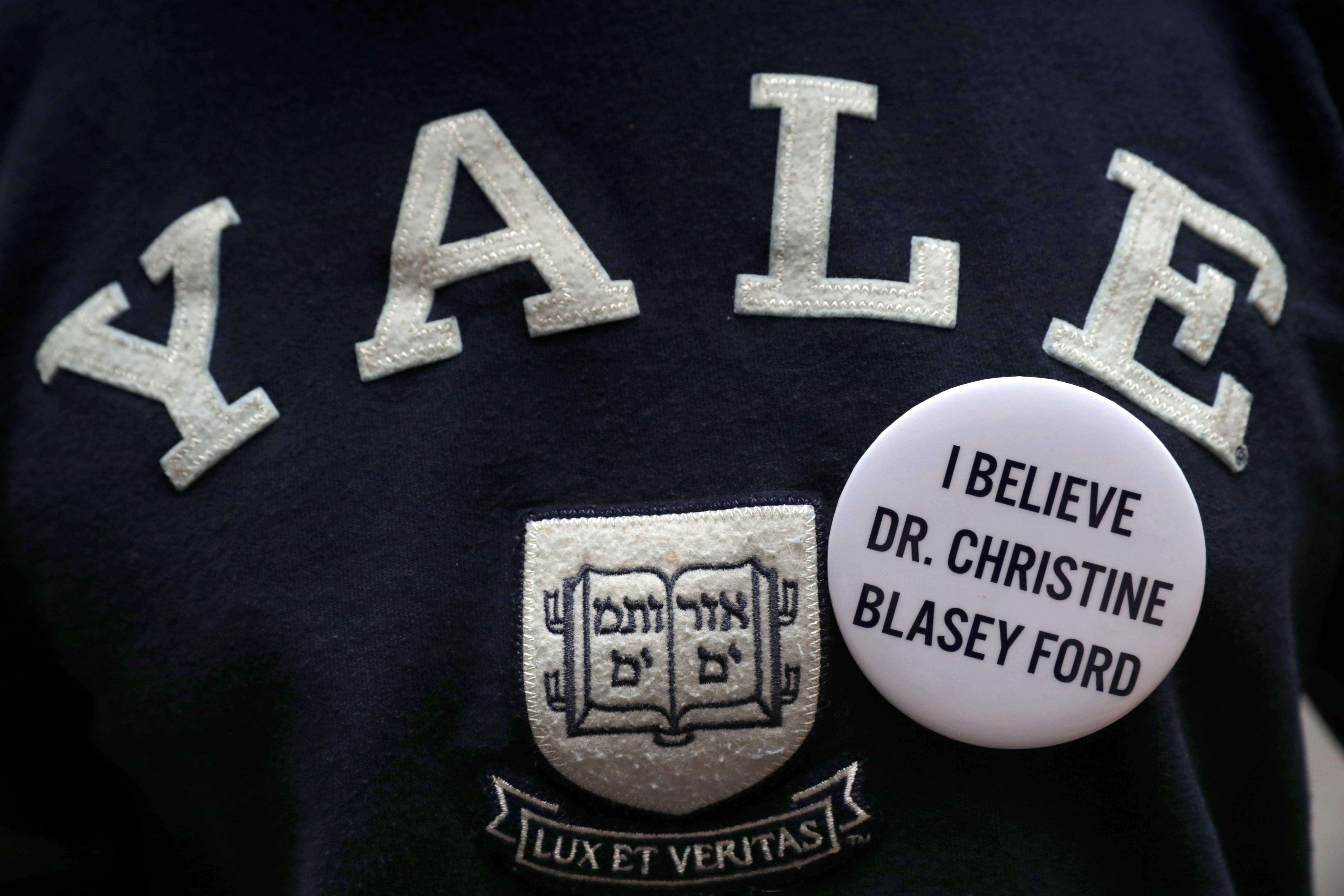 A Yale sweatshirt with a pin in support of Christine Blasey Ford