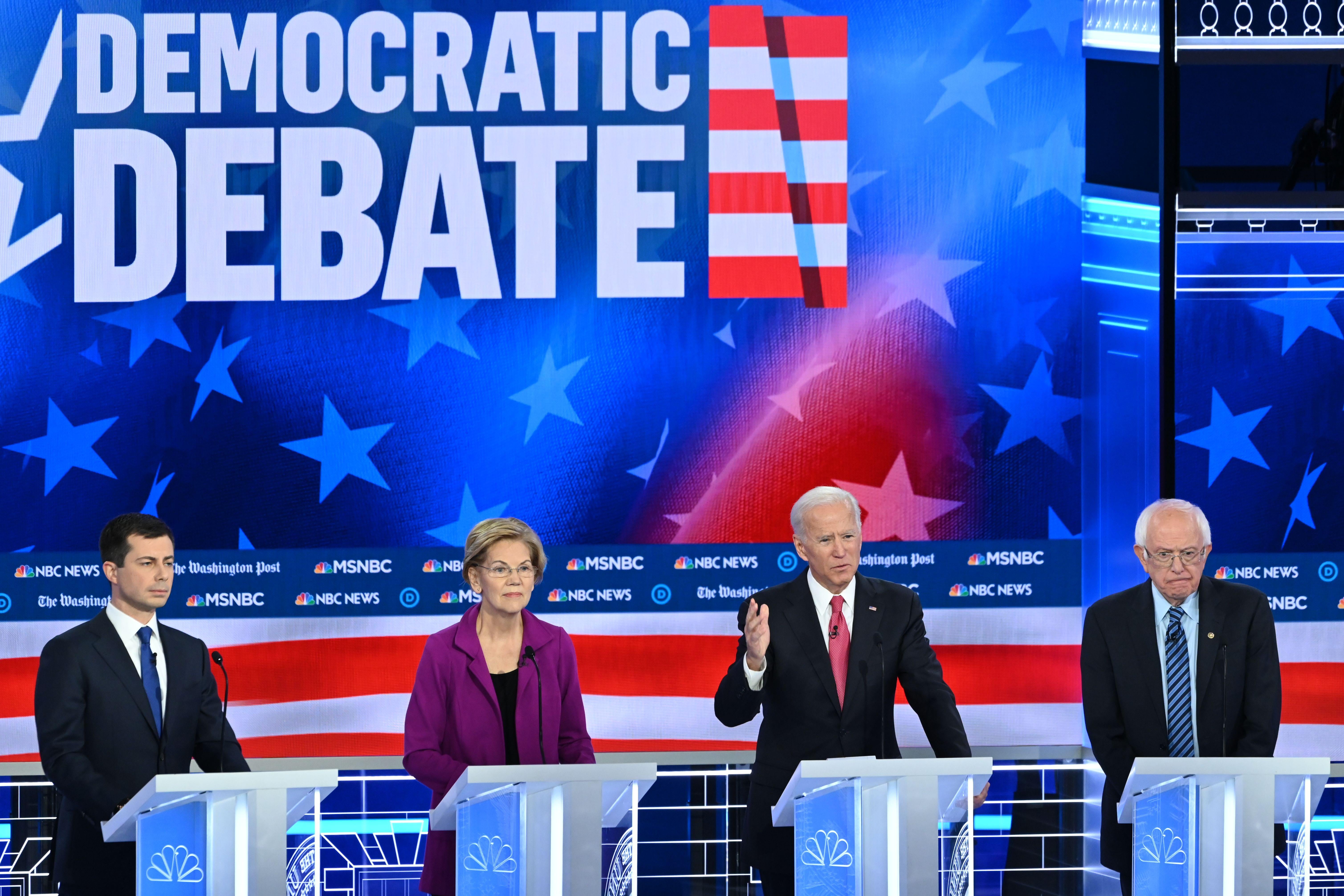 Democratic presidential hopefuls Pete Buttigieg, Elizabeth Warren, Joe Biden, and Bernie Sanders speak during the fifth Democratic primary debate in Atlanta, Georgia on November 20, 2019.