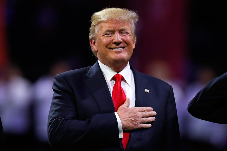 President Donald Trump on field during the national anthem prior to the CFP National Championship presented by AT&T between the Georgia Bulldogs and the Alabama Crimson Tide at Mercedes-Benz Stadium on January 8, 2018 in Atlanta, Georgia. 