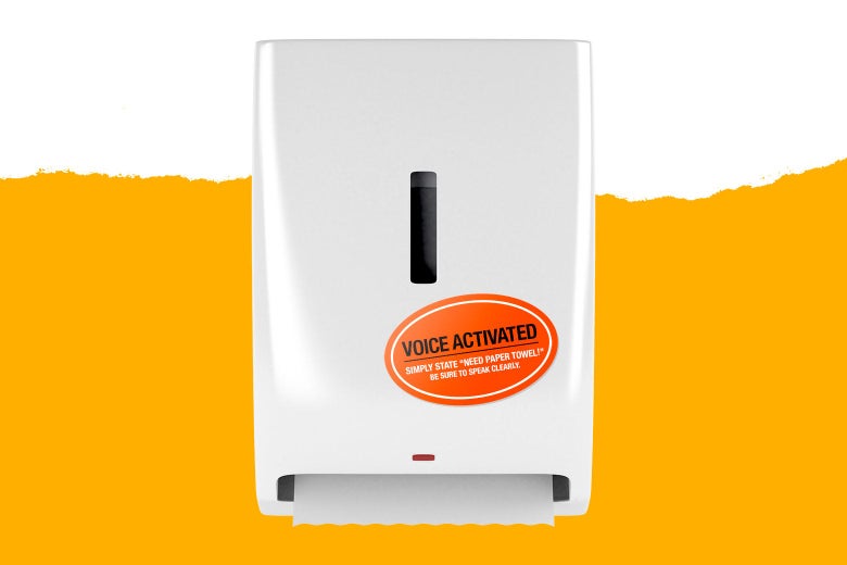 A paper towel dispenser bears a sticker that says, "Voice Activated. Simply state 'need paper towel!' Be sure to speak clearly."