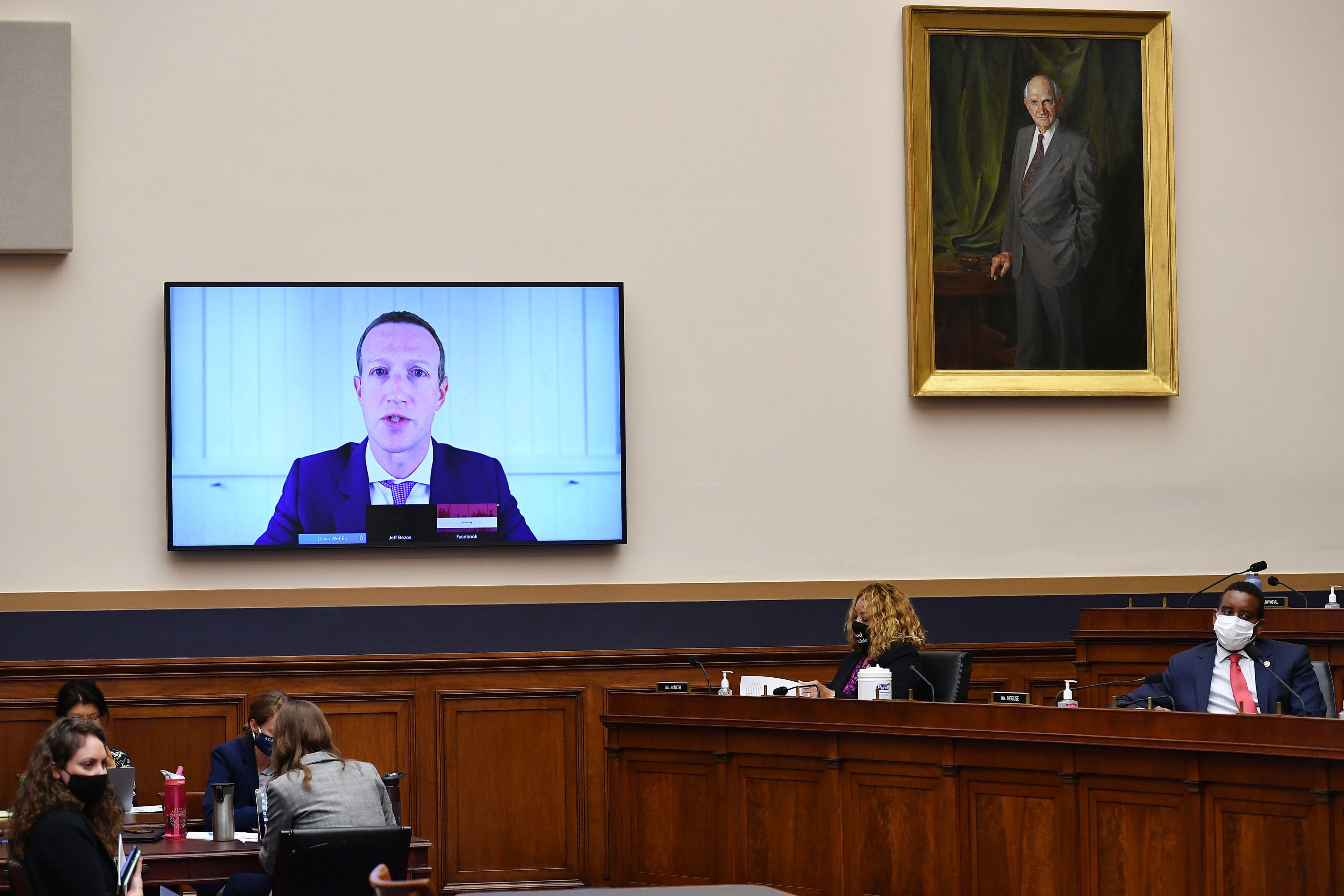Mark Zuckerberg on a TV screen testifying before the House Judiciary Subcommittee on Antitrust, Commercial, and Administrative Law on July 29