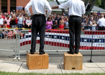Mitt Romney, right, and Paul Ryan, left, speak to an overflow crowd during a campaign rally at Randolph Macon College in August in Ashland, Virginia.