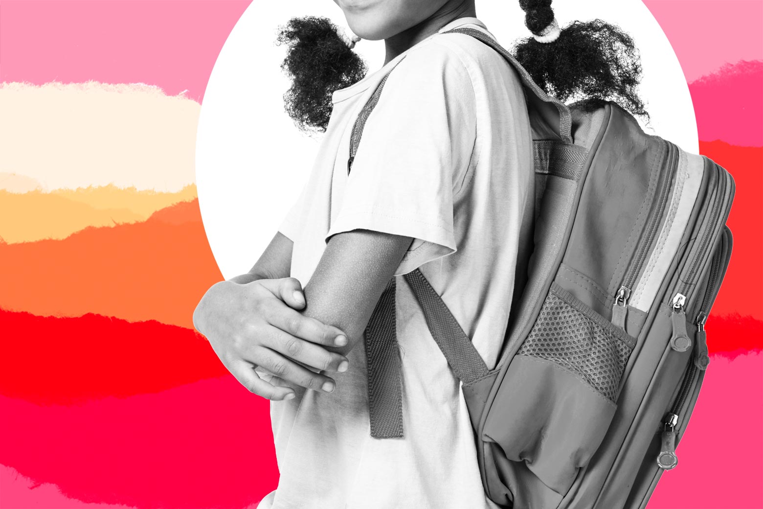 A girl wears a backpack.
