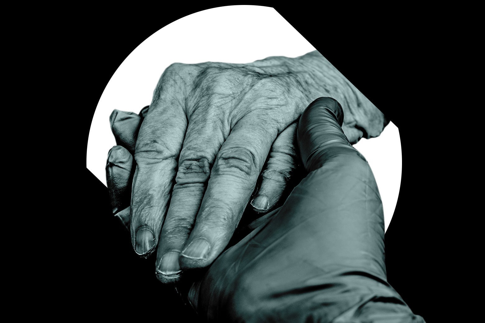 A gloved hand holding an older patient's hand