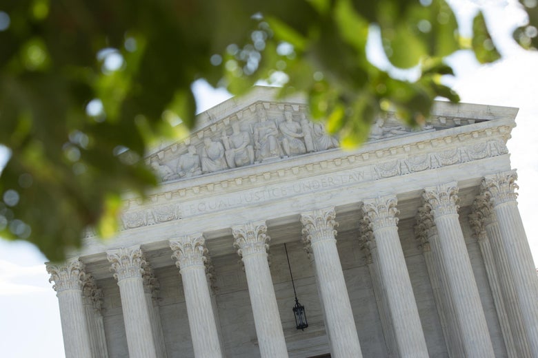 WASHINGTON, DC - JUNE 30: A general view of the U.S. Supreme Court on June 30, 2020, at an angle, with leaves in front.