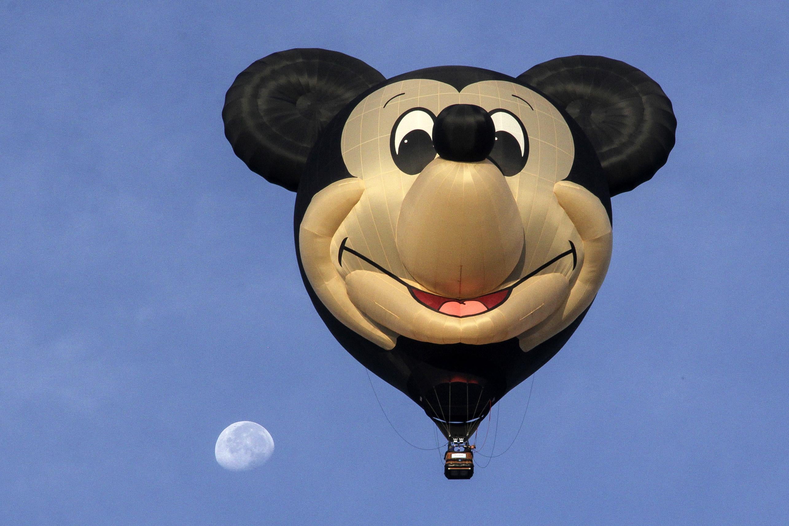 A Mickey Mouse hot air balloon in the sky in Mexico