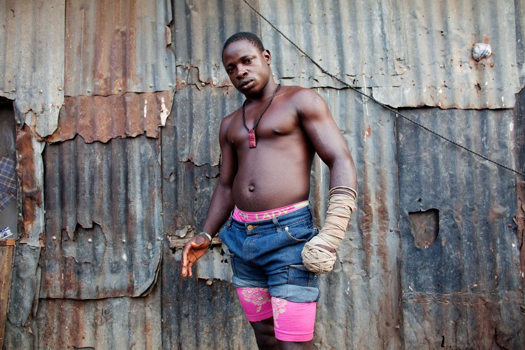 Lagos, Nigeria- Dambe boxer 'Shago' Rikishi, 25, poses for a portrait, in Lagos, Nigeria.