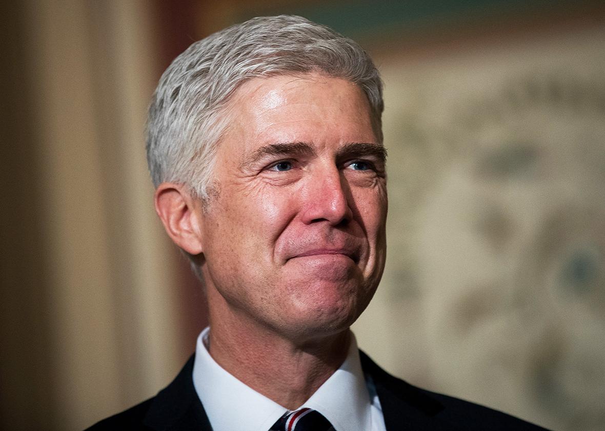 Supreme Court nominee Neil Gorsuch looks on as Senate Judiciary chairman Sen. Chuck Grassley speaks to reporters before their meeting on Capitol Hill, February 1, 2017 in Washington, DC.