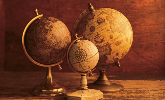 Three globes with world map backdrop