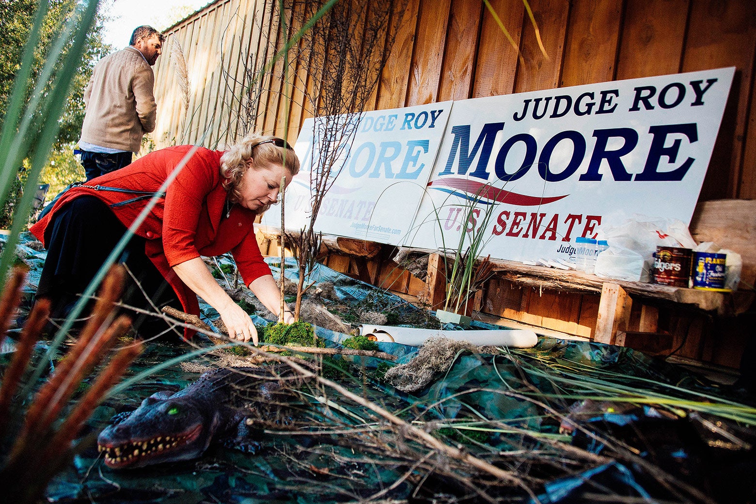 Janet Porter decorates a fake swamp in Alabama.