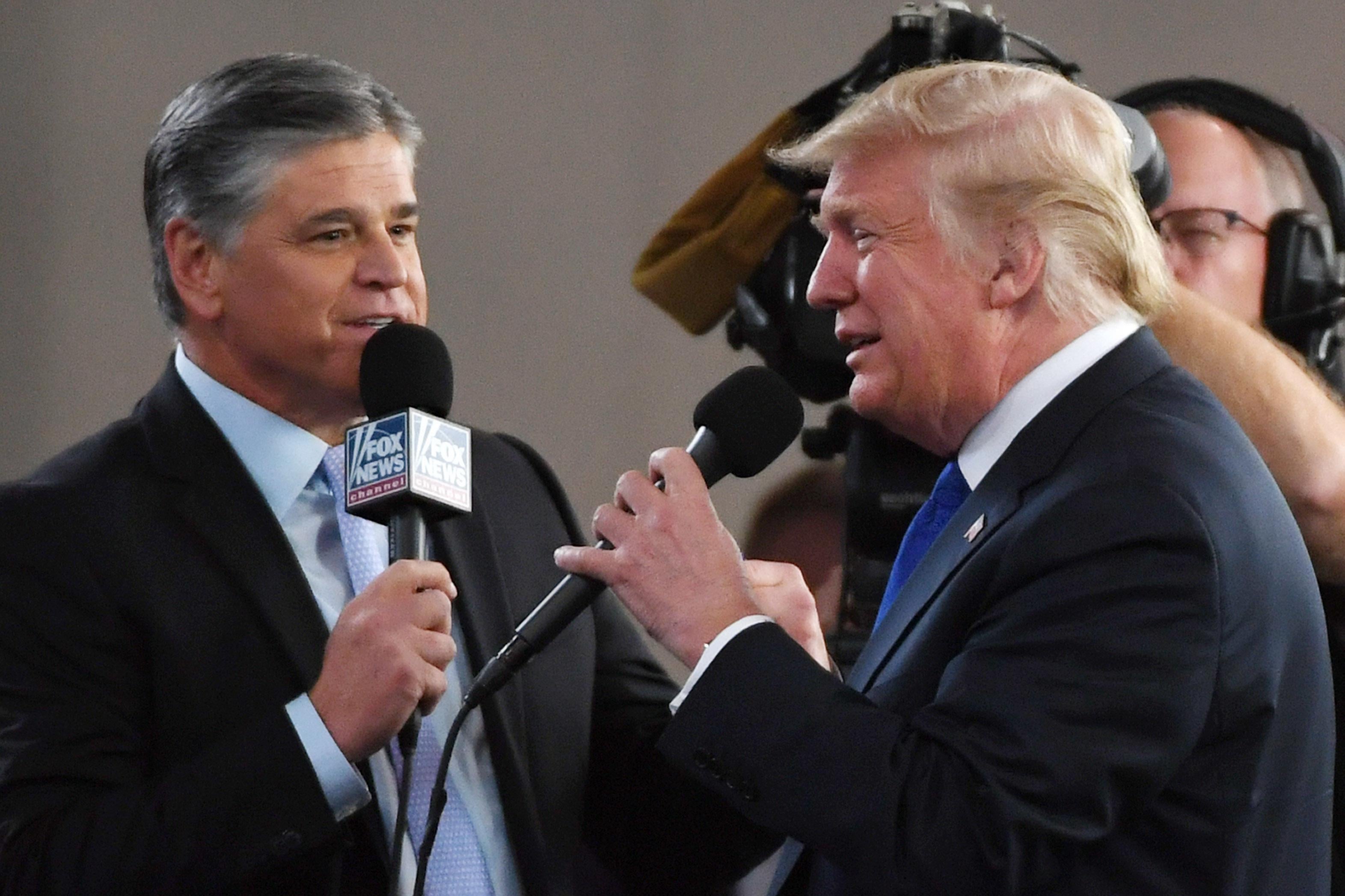Sean Hannity interviews Trump before a campaign rally.