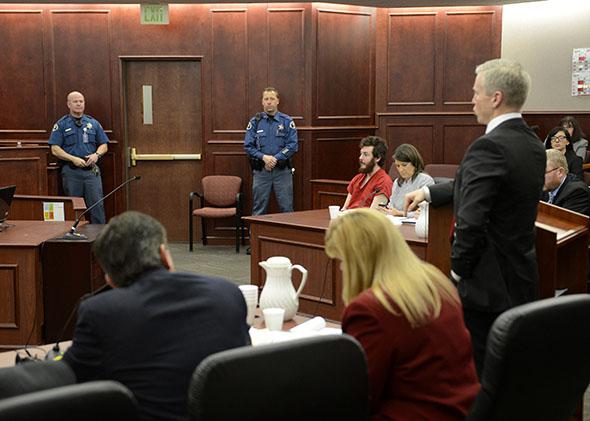 The prosecution team at their table during the proceedings where District Court Judge William Sylvester entered a Not Guilty plea on behalf of Aurora theater shooting suspect James Holmes