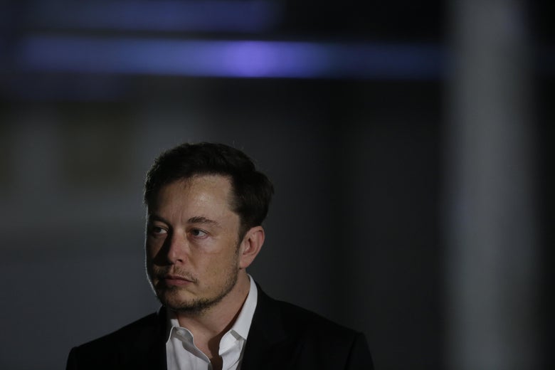 Elon Musk listens as Chicago Mayor Rahm Emanuel talks about constructing a high speed transit tunnel on June 14, 2018 in Chicago Illinois.
