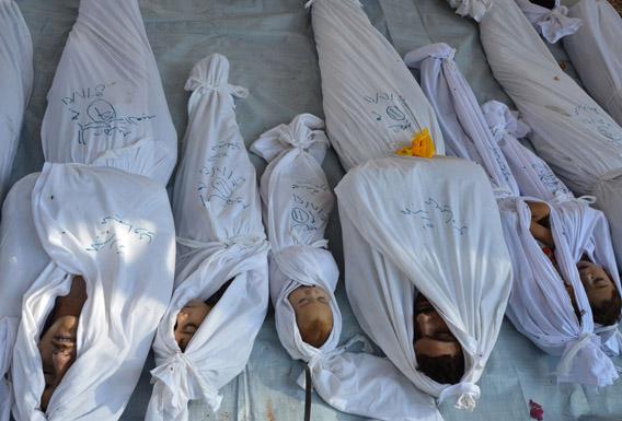 Bodies of people activists say were killed by nerve gas in the Ghouta region are seen in the Duma neighbourhood of Damascus August 21, 2013. 