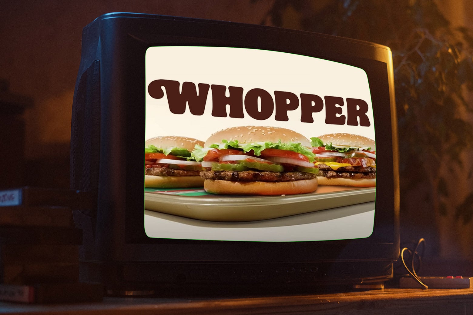 A television. with a Burger King commercial on i t. 
