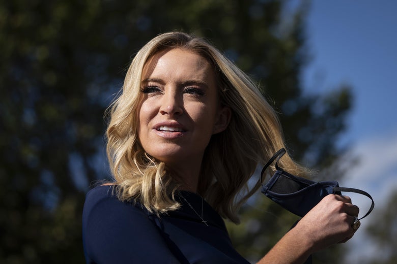 A close-up of Kayleigh McEnany taking off her mask