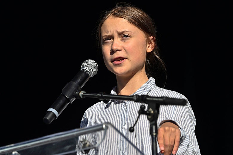 Greta Thunberg at a podium.