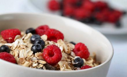 Granola with raspberries and blueberries.