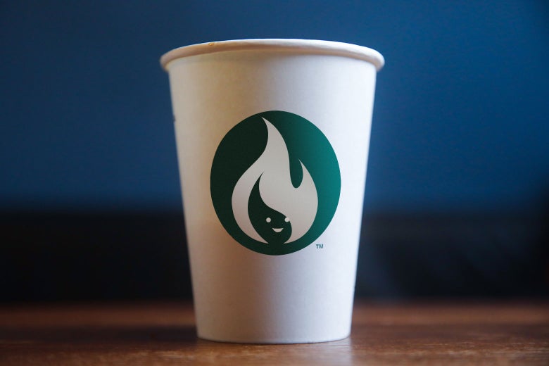 A Starbucks coffee cup modified with an anthropomorphic flame instead of the mermaid in the logo