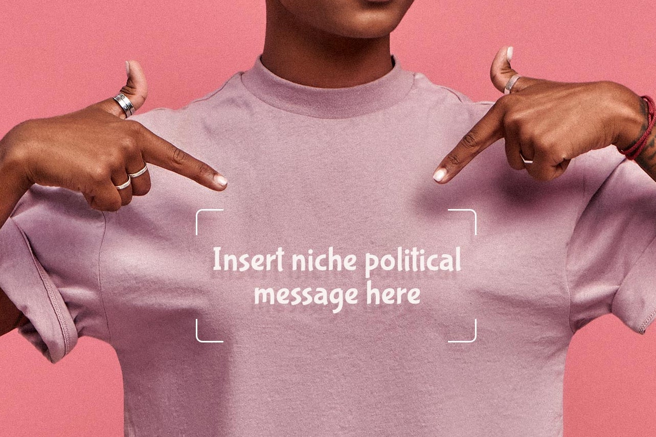 A close-up of a woman's shirt with the phrase "Insert niche coded political message here."