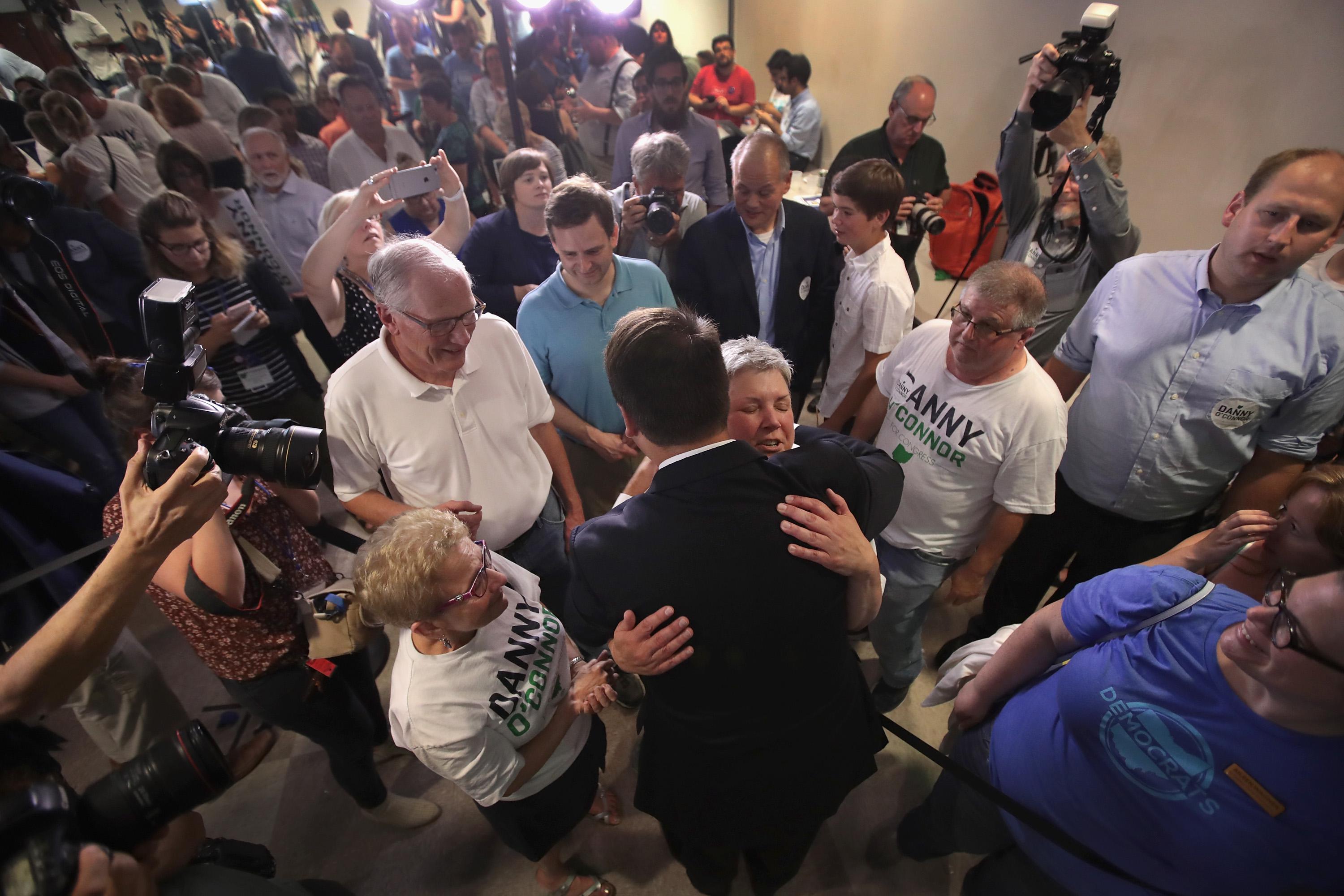 Danny O'Connor greets supporters at an election-night rally.