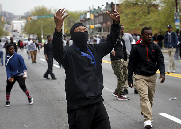 Demonstrators yell at Baltimore police during clashes in Baltimore, Maryland April 27, 2015.