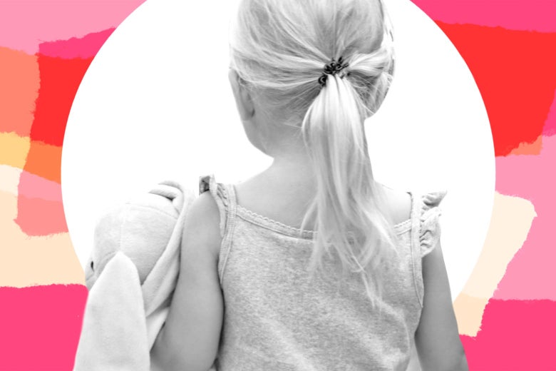 A toddler girl carrying a stuffed animal, seen from the back.