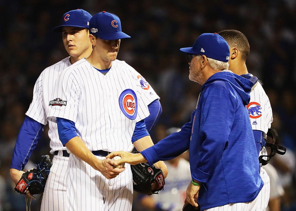 Manager Joe Maddon of the Chicago Cubs relieves Kyle Hendricks #28 in the sixth inning against the Los Angeles Dodgers during game two of the National League Championship Series at Wrigley Field on October 16, 2016 in Chicago, Illinois.  