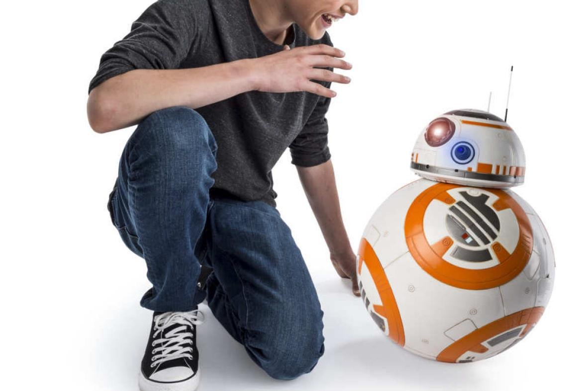 A boy and the BB-8 droid.