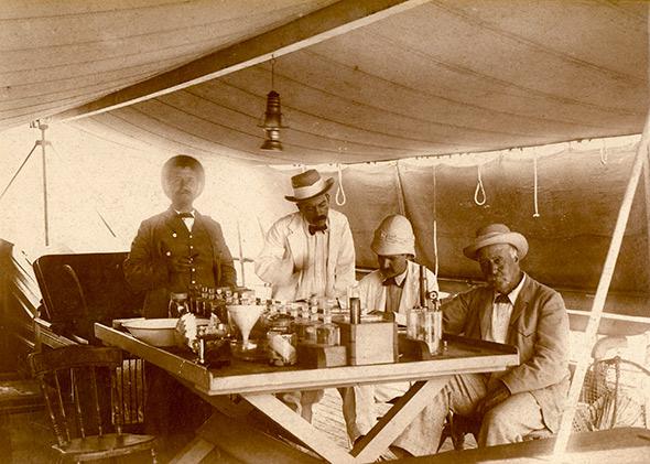 Alex Agassiz (far right), Alfred Mayor (second from right), and William Woodworth (third from right) on board the Croydon, 1896.