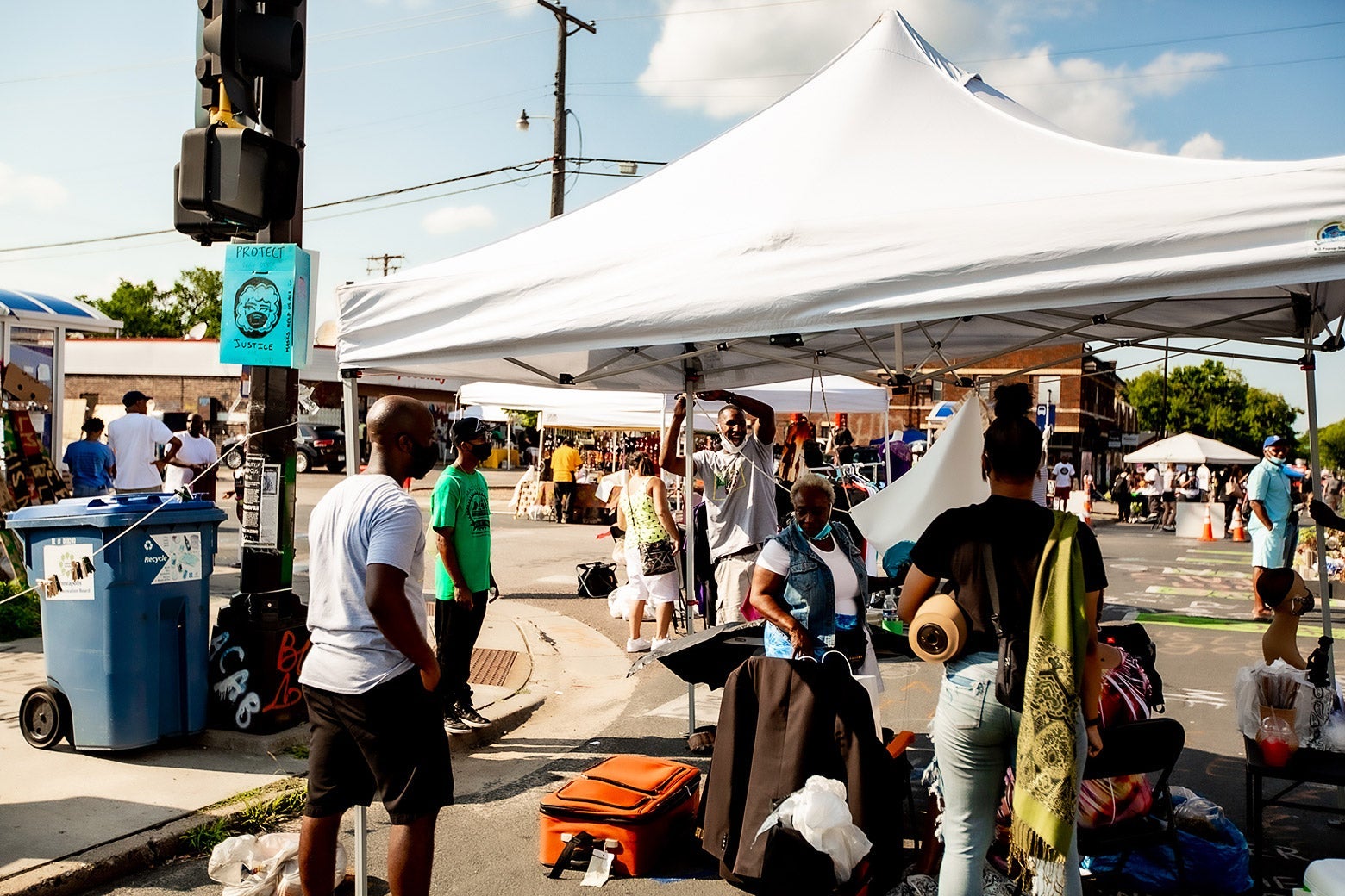 People set up tents under which to sell their wares.