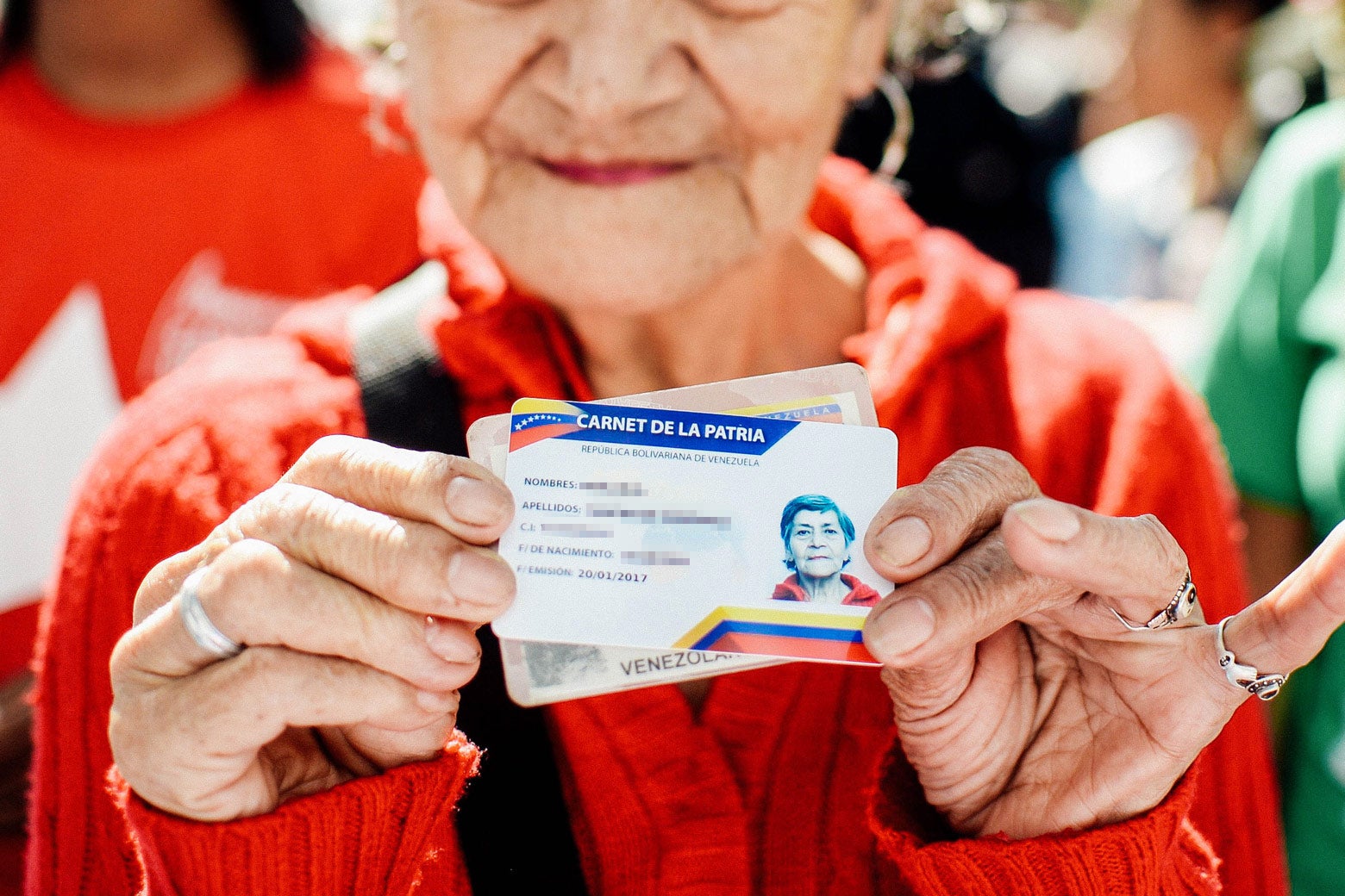 A woman holds up her card.