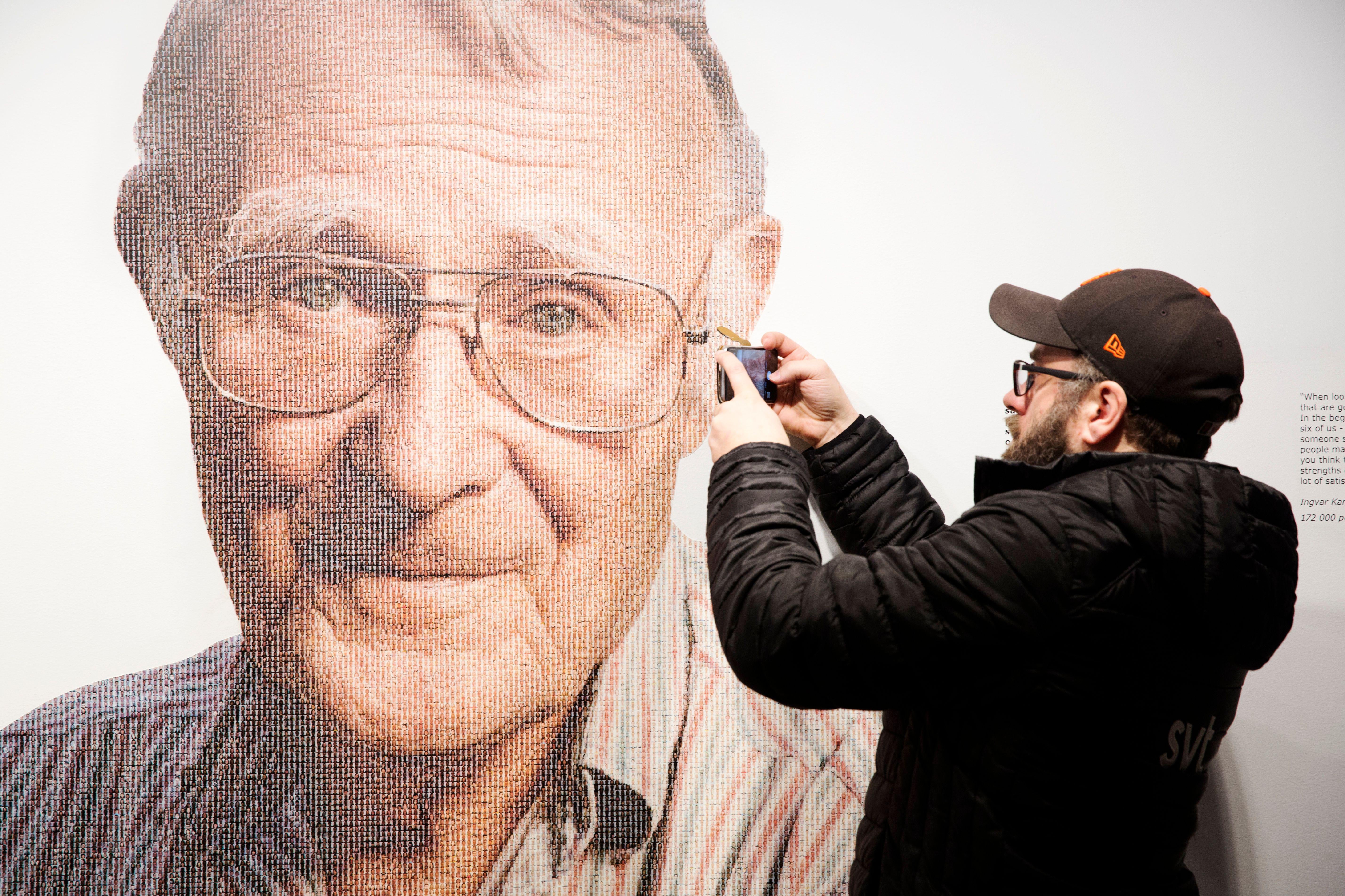 A visitor takes a mobile photo of a picture of Ingvar Kamprad, founder of Swedish multinational furniture retailer IKEA, at the IKEA museum in Almhult, Sweden, on January 28, 2018. Ingvar Kamprad, the enigmatic founder of Swedish furniture giant IKEA, died aged 91 on Sunday, the company said.