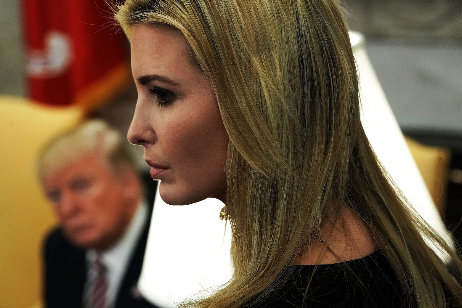 U.S. President Donald Trump (L) and adviser and daughter Ivanka Trump listen during a working session regarding the Opportunity Zones provided by tax reform in the Oval Office of the White House February 14, 2018 in Washington, DC. 